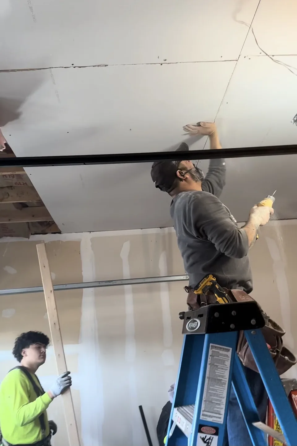 The JC Yellowstone team working on a ceiling