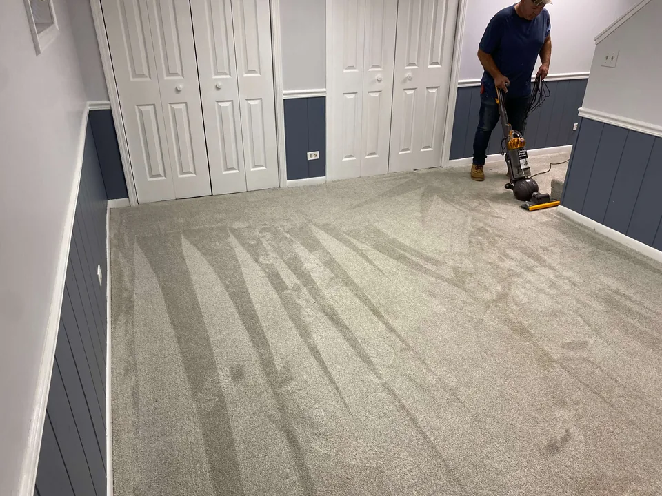 Fresh carpet and white closet doors in a renovated room